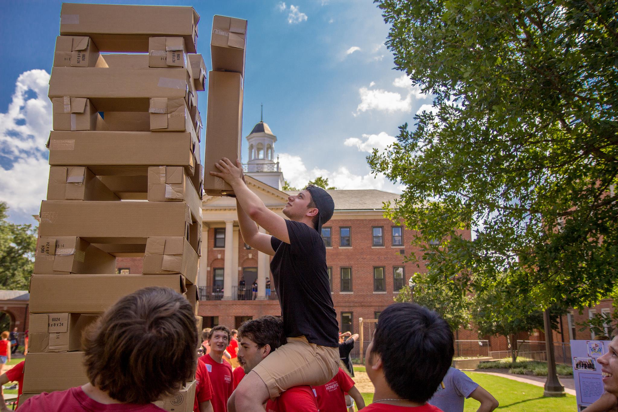 Students in the Honors Village play giant Jenga on the Quad Commons.