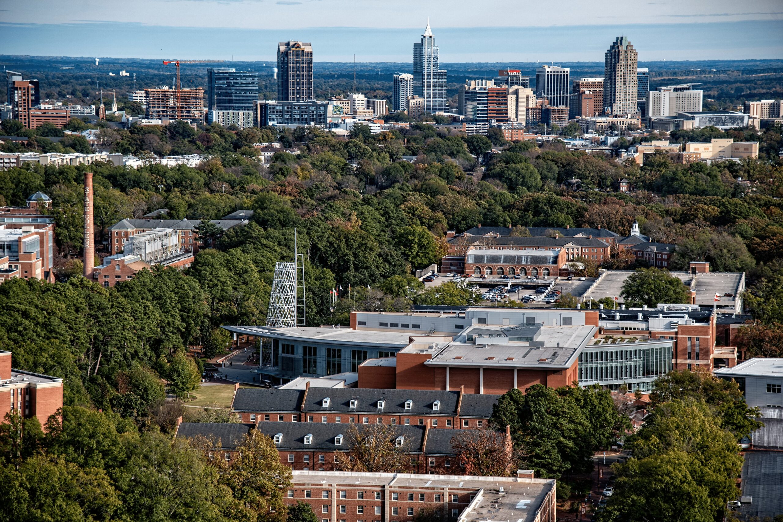 Aerial view of Talley Student Union with a skyline of downtown Raleigh at the top